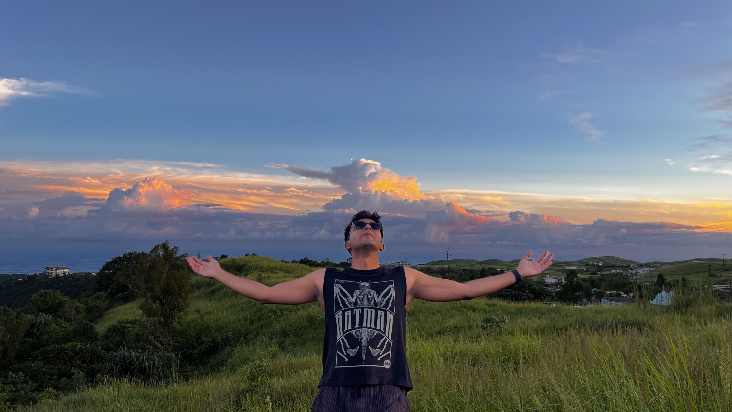 Vedant on a hilltop at sunset